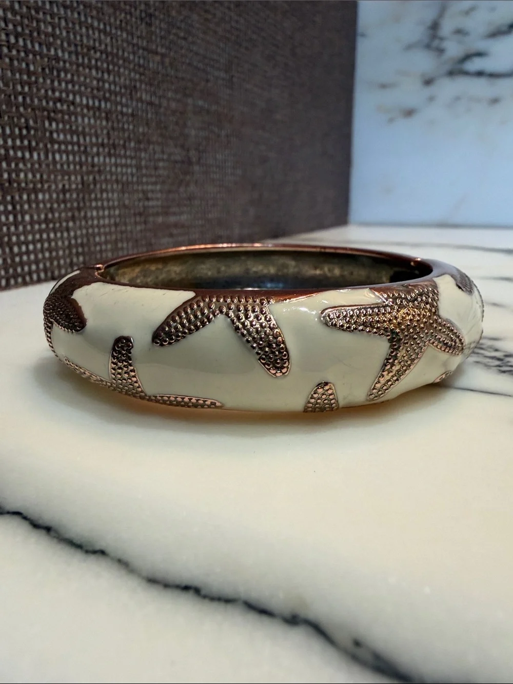 White enamel Bangle Bracelet with Textured gold tone Starfish Accents